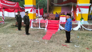 Wakili Kapolsek, Bhabinkamtibmas Pospol Buntu Batu Hadiri Aubade dan Penurunan Bendera HUT RI ke 81